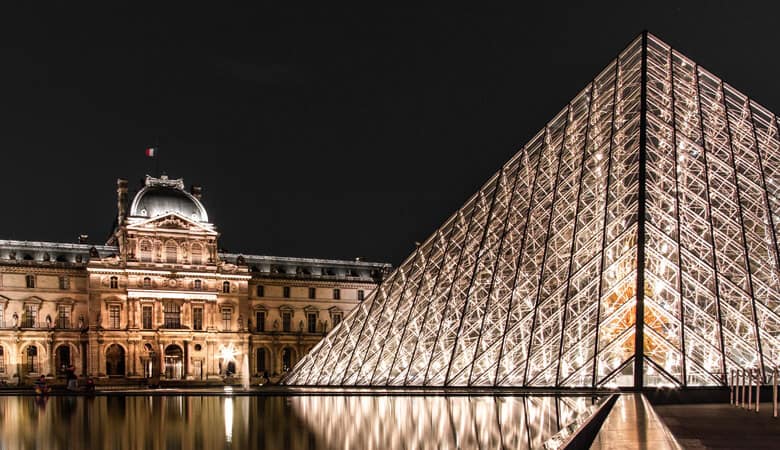 Louvre museum at night in Paris