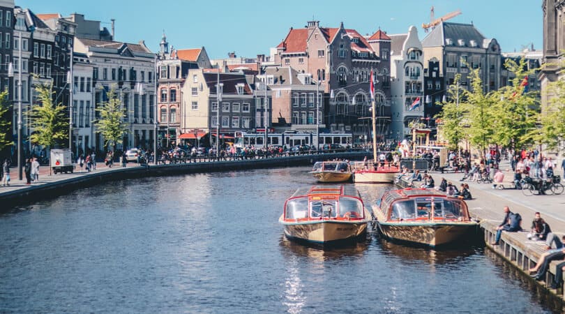 Boats in river in Amsterdam
